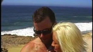 Lucky guy fucks two hot blondes on the beach