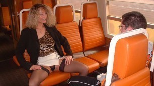 Milf and young boy in train